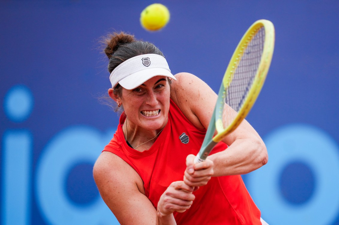 Rebecca Marino hits a two handed backhand shot