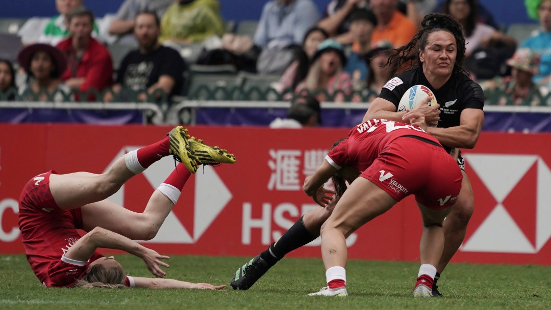 New Zealand's Portia Woodman-Wickliffe tries to break away from Canada's Shalaya Valenzuela during the second day of the Hong Kong Sevens rugby tournament in Hong Kong, Saturday, April 1, 2023.