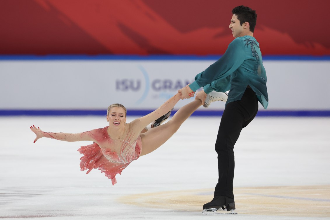 Zachary Lagha swings Marjorie Lajoie by her legs in a stationary lift