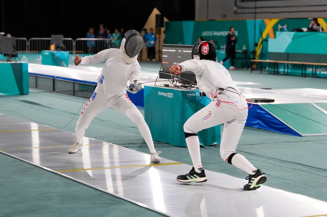 Two fencers duel