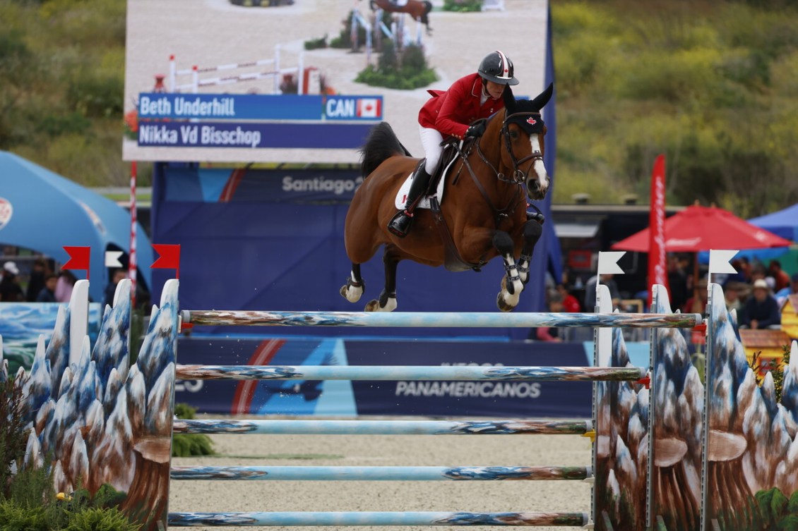 Beth Underhill and her horse clear a barrier