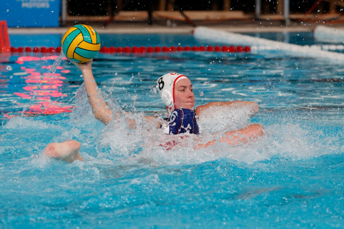 Elyse Lemay Lavoie holds the ball in the air ready to throw it