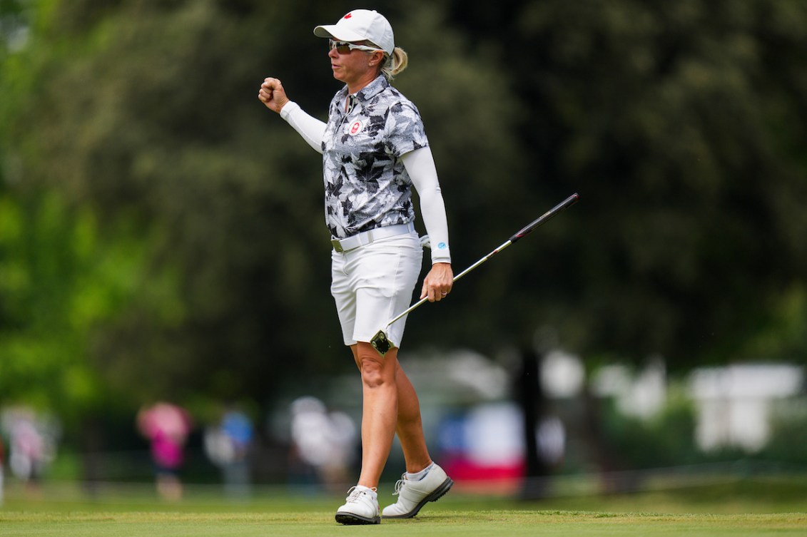 A female Team Canada golfer celebrates