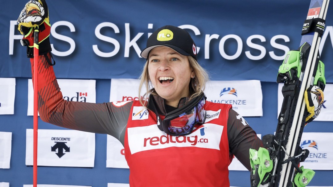 Canada's Hannah Schmidt celebrates her victory on the podium following the women's final of a World Cup ski cross event at Nakiska Ski Resort in Kananaskis, Alta., Saturday, Jan. 20, 2024.