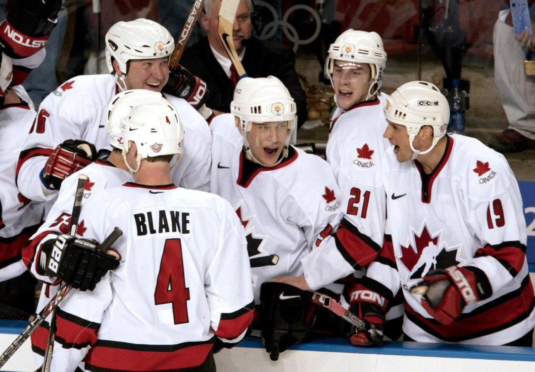 Five Canadian hockey players celebrate a goal