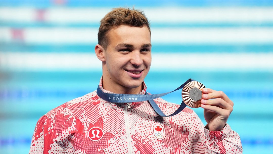 Ilya Kharun poses with his medal