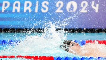 Tristan Jankovics swims backstroke