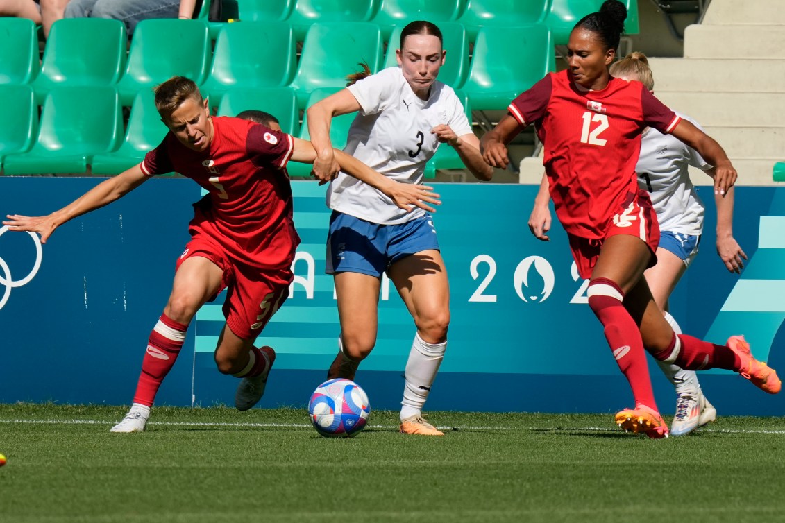 Jade Rose battles for the ball in a match against New Zealand.