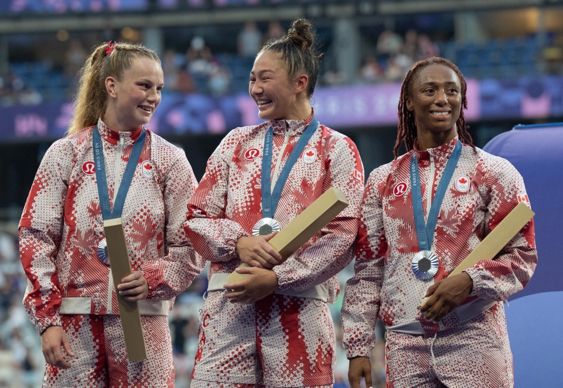 Team Canada players with their Olympic silver medals.