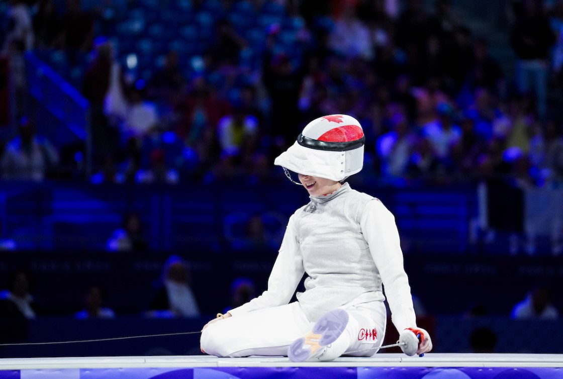 Eleanor Harvey kneels in disbelief after winning bronze