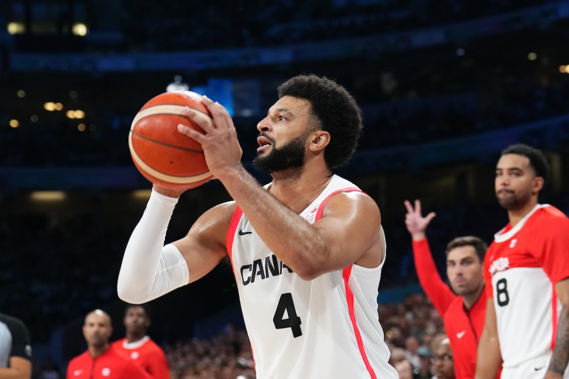 Jamal Murray prepares to shoot a basketball 