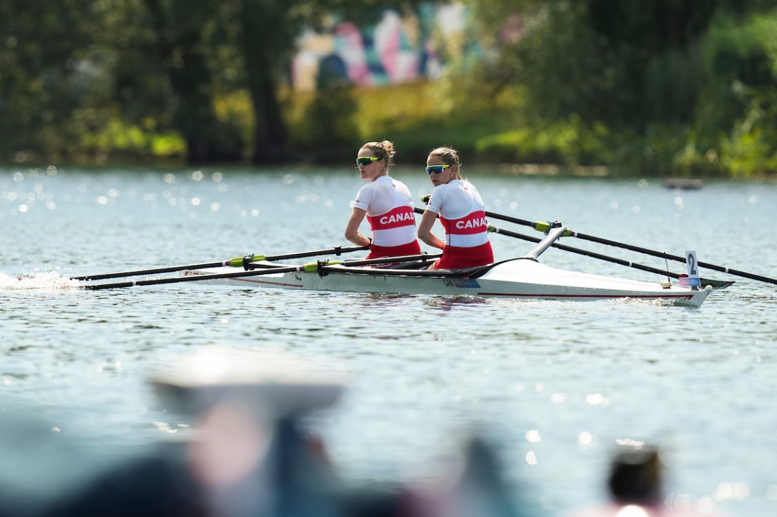 Jenny Casson and Jill Moffatt look over their shoulder from their boat