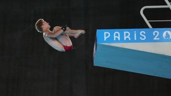 Rylan Wiens performs a dive in tuck position