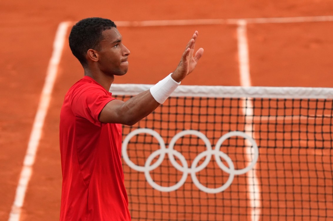 Canada's Felix Auger-Aliassime celebrates his win over Norway's Casper Ruud in men's singles quarter-final tennis action at the Summer Olympics in Paris on Thursday, Aug.1, 2024.