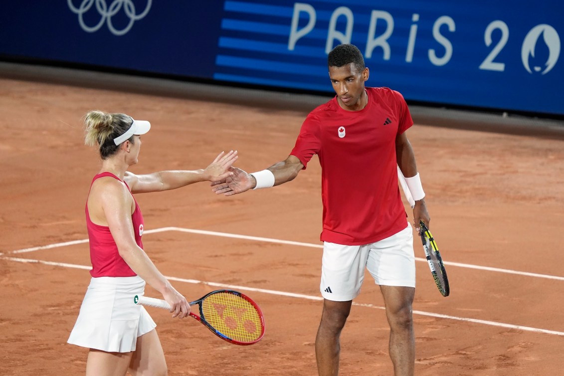 Canada's Felix Auger-Aliassime and Gabriela Dabrowski react during mixed doubles semifinal tennis action against Czechia's Tomas Machac and Katerina Siniakova at the Summer Olympics in Paris on Thursday, Aug.1, 2024. THE CANADIAN PRESS/Adrian Wyld