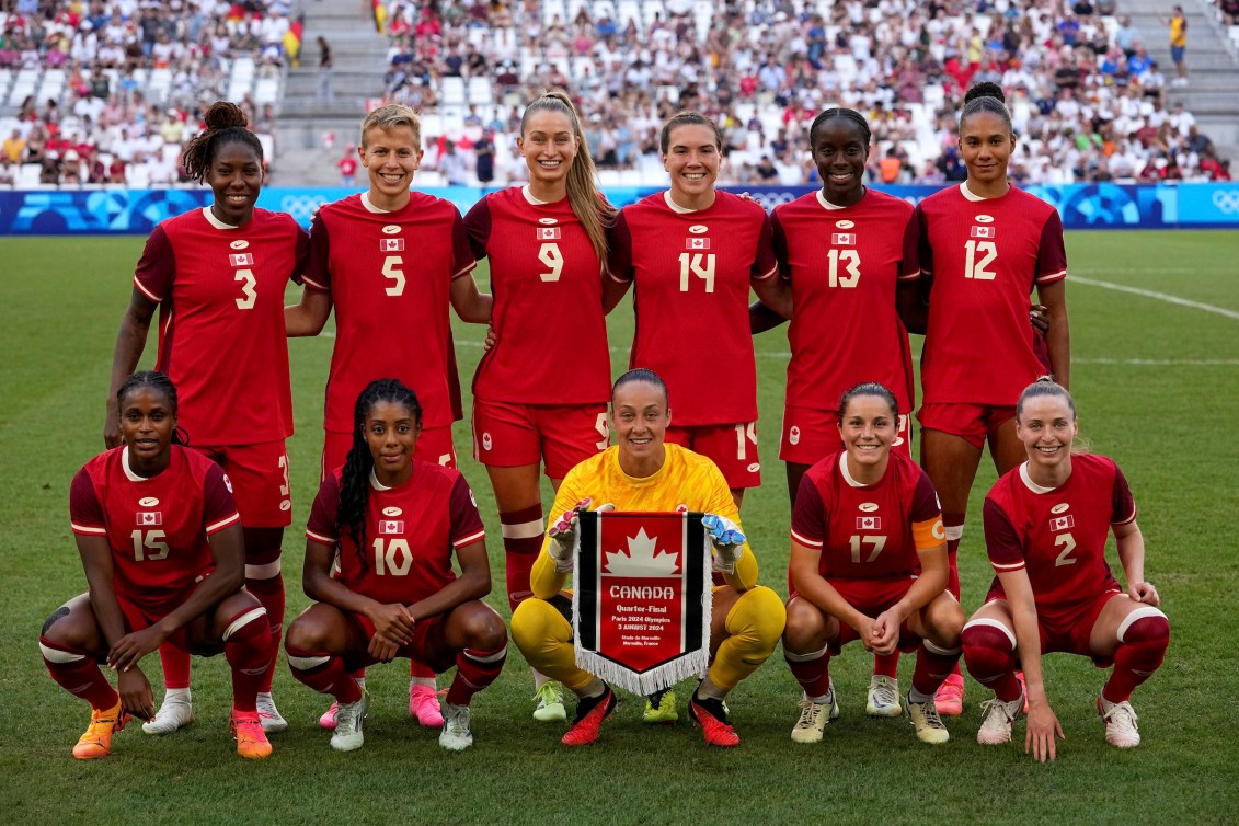 Team Canada poses for a photo prior to the match against Germany.