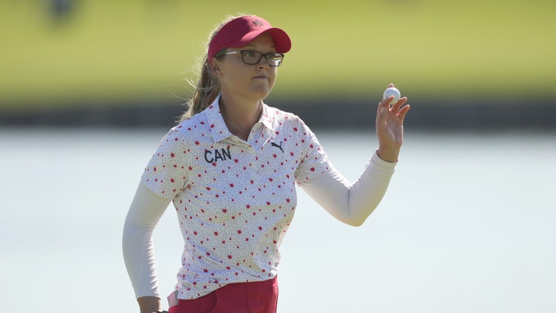 Brooke Henderson acknowledges the crowd with the ball in her hand