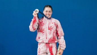 Maude Charron celebrates with her silver medal.