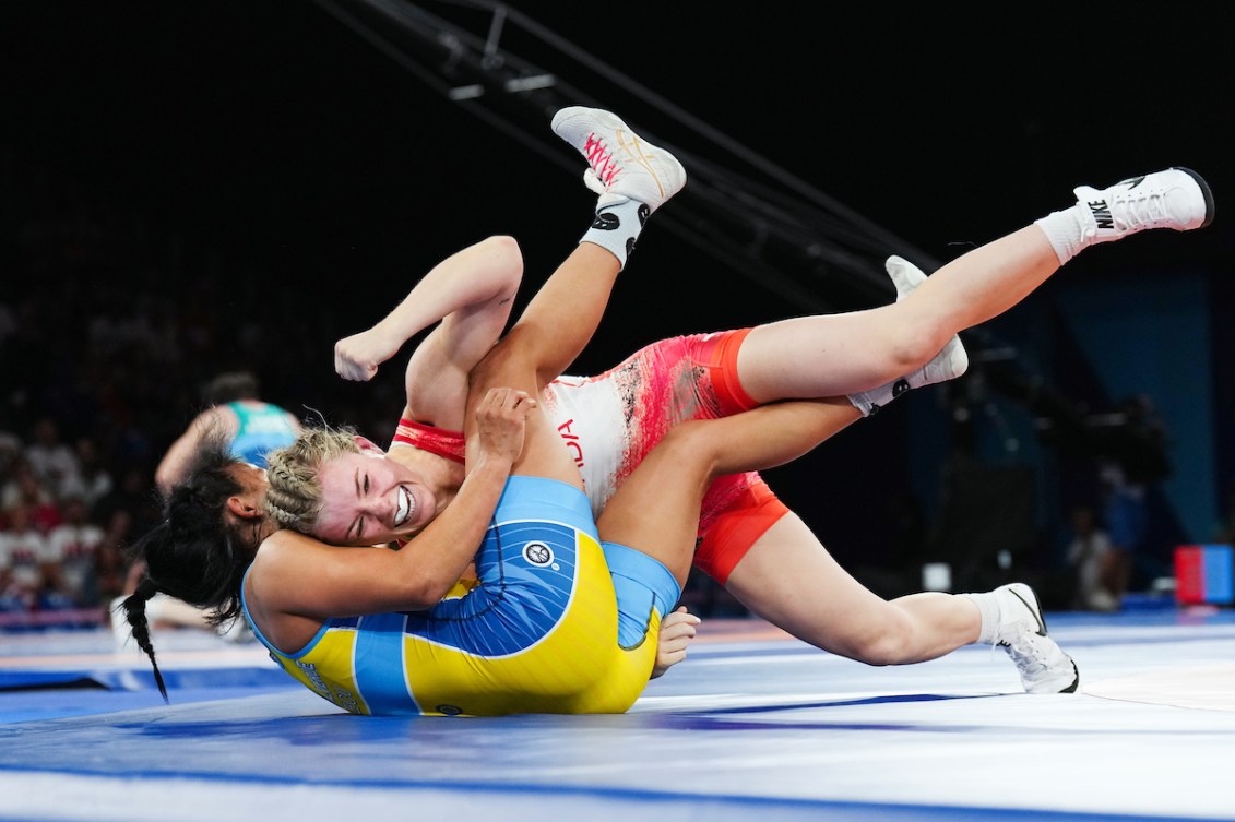 Hannah Taylor celebrates as she pins an opponent