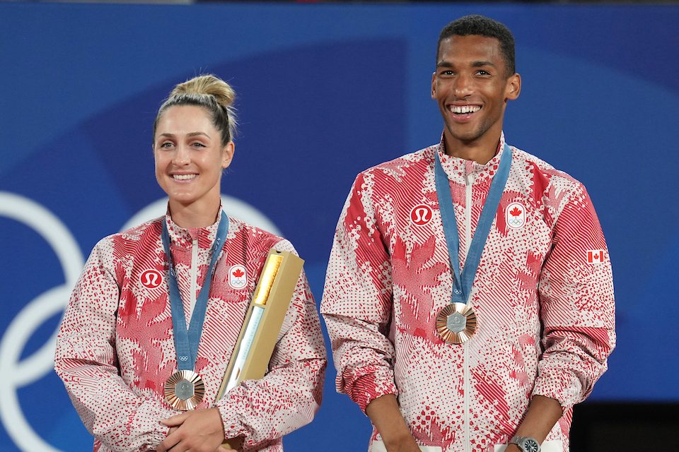 Gaby Dabrowski and Felix Auger-Aliassime wear bronze medals with red and white track suits