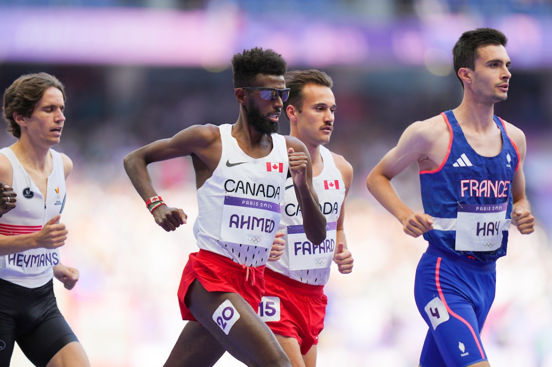 Moh Ahmed and Thomas Fafard run in the men's 5000m heat.