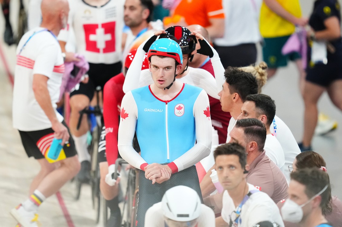 Dylan Bibic wears a helmet and blue jersey