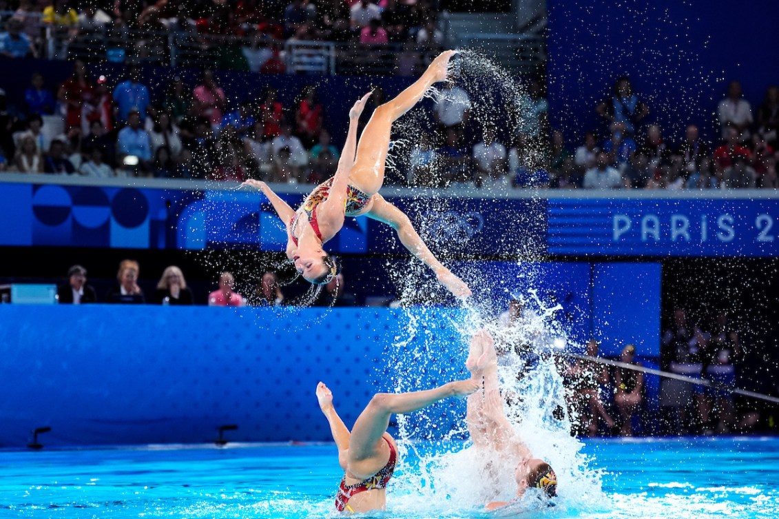 Team Canada’s artistic swimming team performs a jump