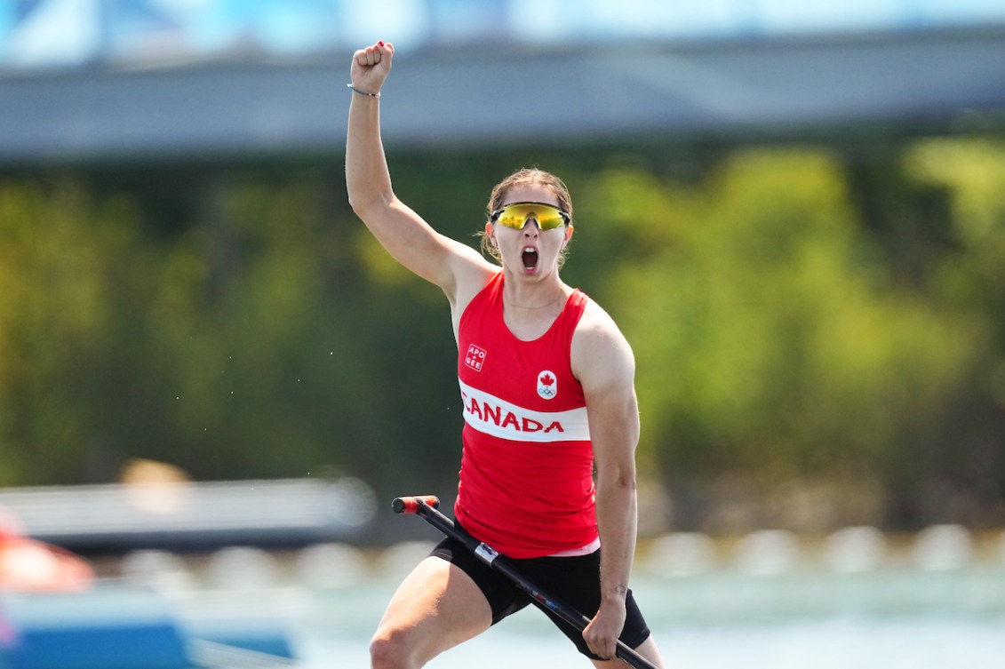 Katie Vincent celebrates her gold medal win in the women's C-1 200m.