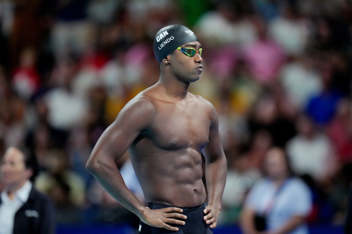 Josh Liendo standing poolside