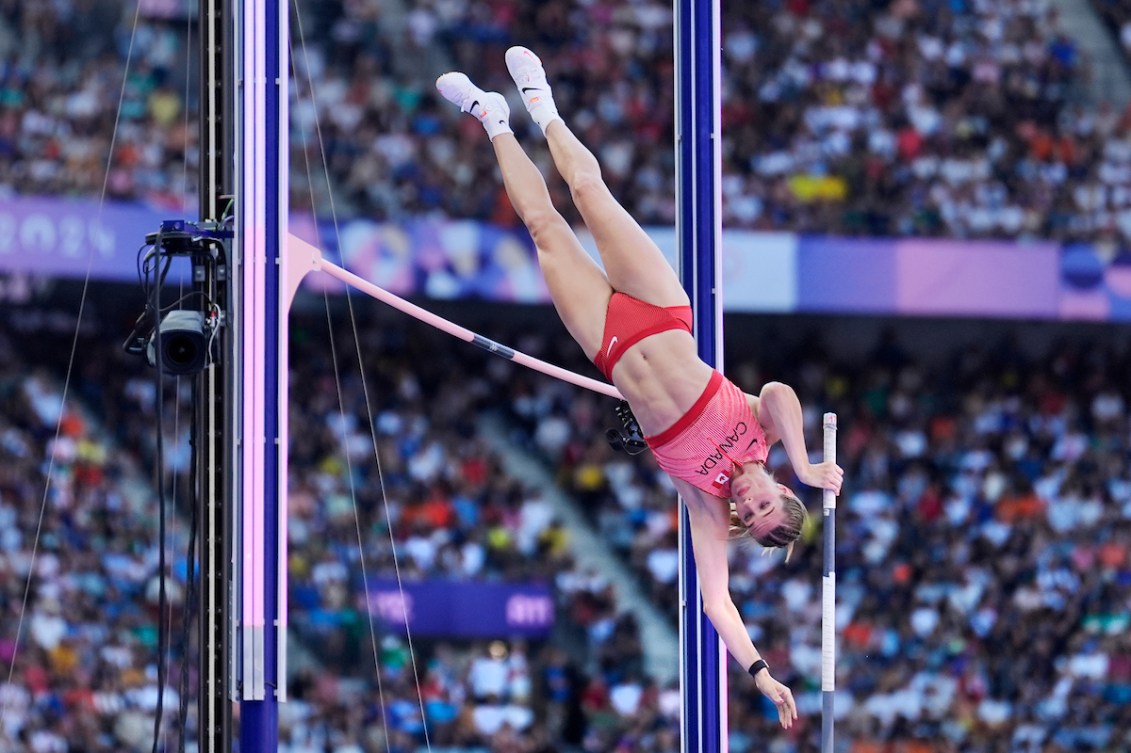 Alysha Newman about to go over the bar in pole vault 