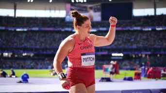 Sarah Mitton reacts during the shot put qualification round on Thursday.