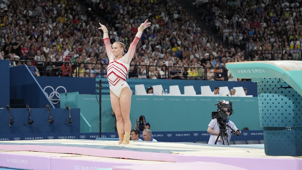 Ellie Black poses for the judges after completing her vault