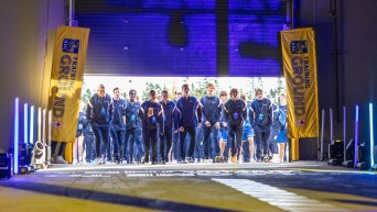 Athletes walk in through a garage door at RBC Training Ground National Final