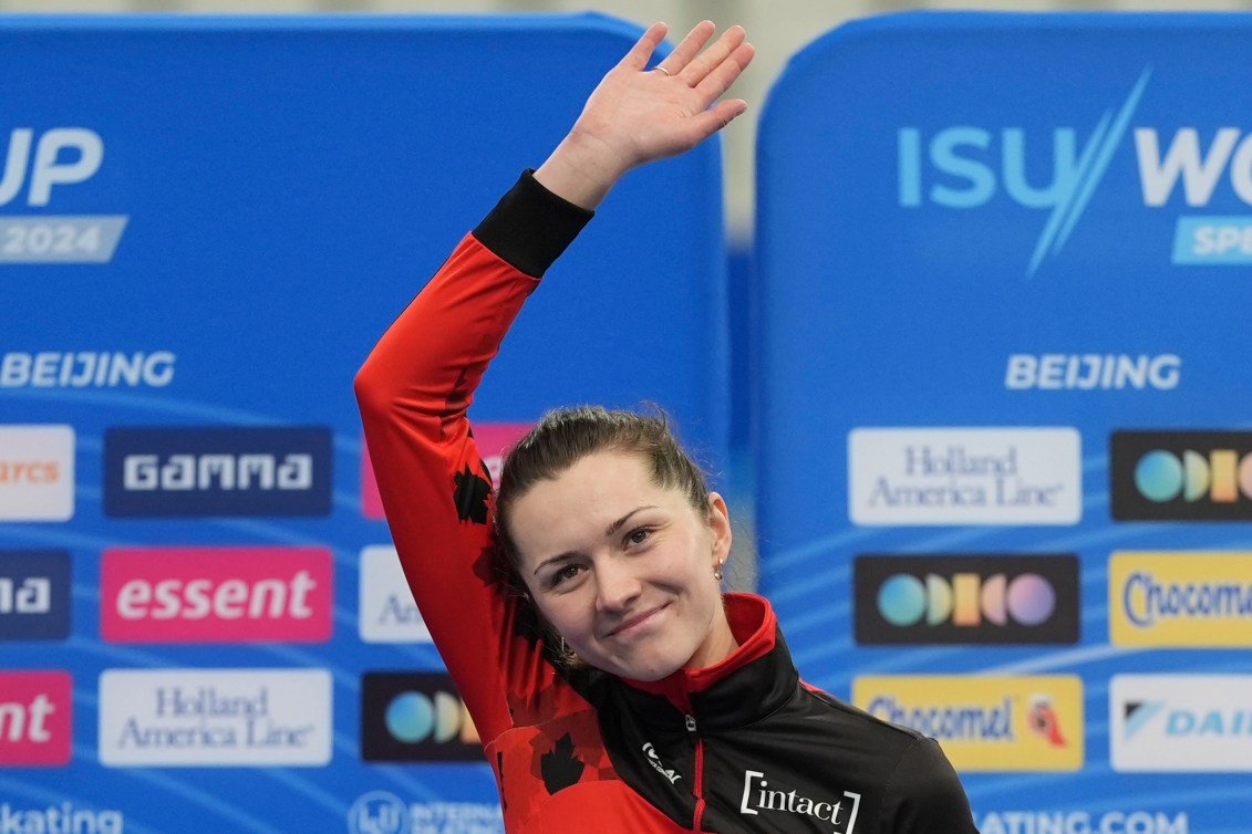 Bronze medalist Isabelle Weidemann of Canada celebrates on the podium for the medal ceremony of the Women 3000m of the ISU World Cup Speed Skating Beijing 2024 held at the National Speed Skating Oval in Beijing, Saturday, Nov. 30, 2024. (AP Photo/Ng Han Guan)