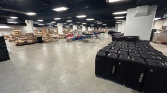 Luggage, boxes, and equipment are stored in a large room