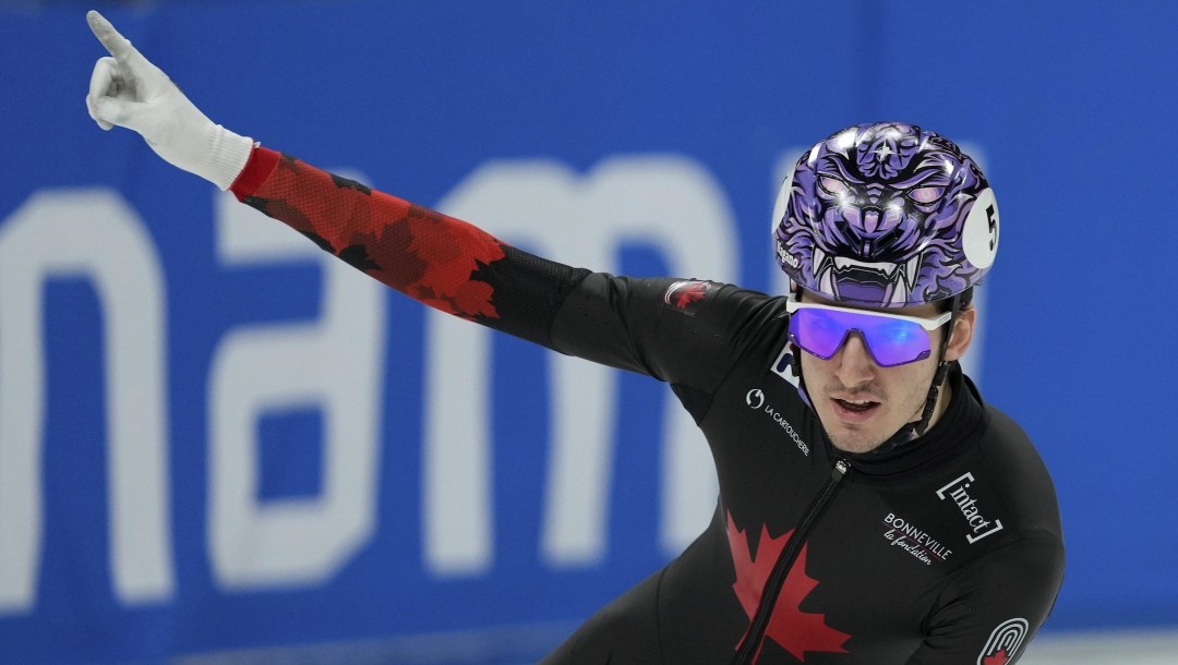 Felix Roussel of Canada celebrates after winning in the men's 1,000-meter finals at the ISU World Tour Short Track Speed Skating held at the Capital Indoor Stadium in Beijing, Sunday, Dec. 8, 2024. (AP Photo/Andy Wong)