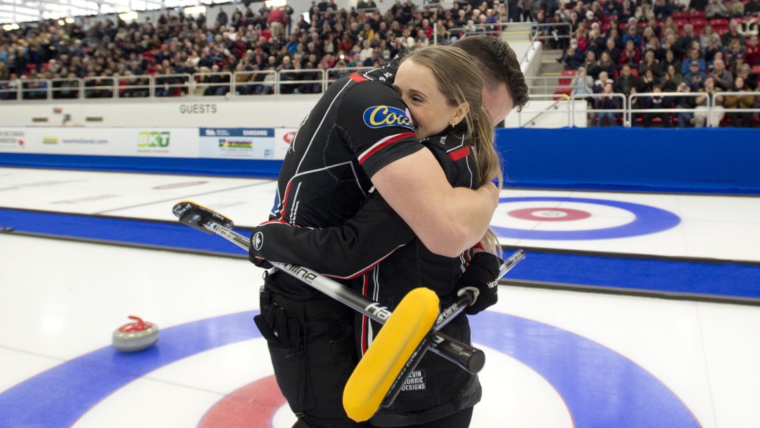 Jocelyn Peterman and Brett Gallant embrace after winning gold at the Canadian mixed doubles curling trials.