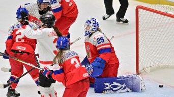 Czech Republic goalkeeper Klara Peslarova, right, fails to save a goal during the IIHF Women's World Championship, Group A, match between Czech Republic and Canada, in Ceske Budejovice, Czech Republic, Monday, April 14, 2025. (Vaclav Pancer/CTK via AP)