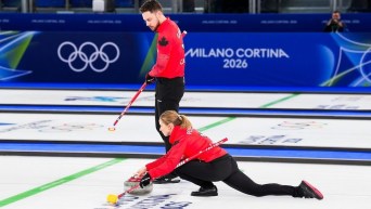 Brett Gallant and Jocelyn Peterman competing in mixed doubles curling