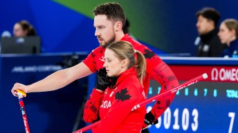 Jocelyn Peterman and Brett Gallant compete in mixed doubles curling