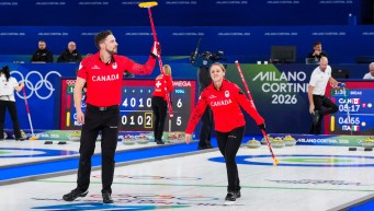 Brett Gallant and Jocelyn Peterman competing in mixed doubles curling