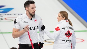 Brett Gallant and Jocelyn Peterman competing in mixed doubles curling