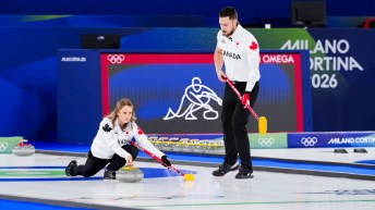 Jocelyn Peterman and Brett Gallant competing in mixed doubles curling
