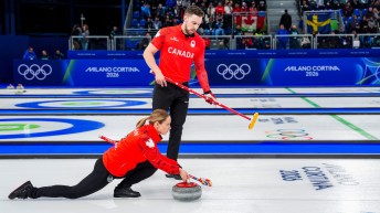 Team Canada’s Jocelyn Peterman and Brett Gallant compete against Korea in mixed doubles curling