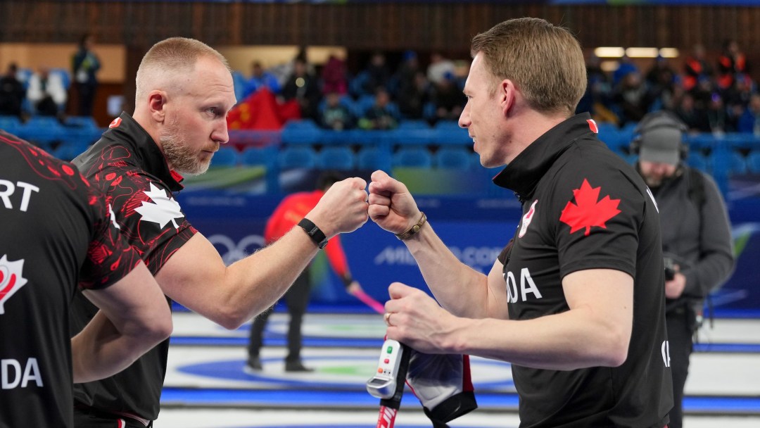 Brad Jacobs and Marc Kennedy compete against USA during men’s curling event