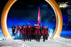 Canadian flag-bearers Mikaël Kingsbury and Marielle Thompson leading Team Canada