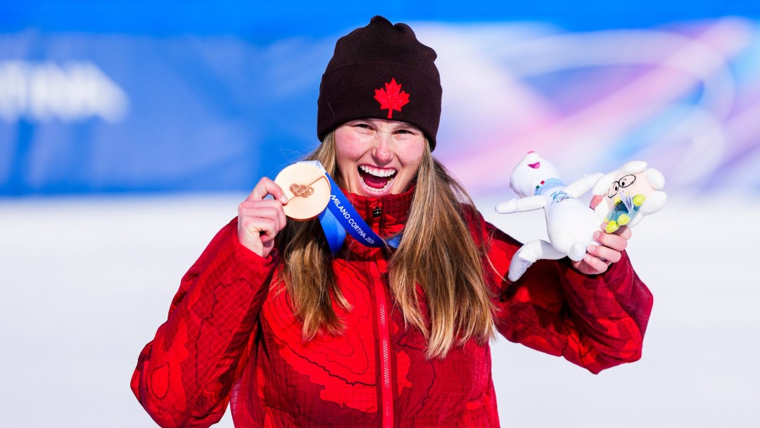 Megan Oldham celebrates with her bronze medal