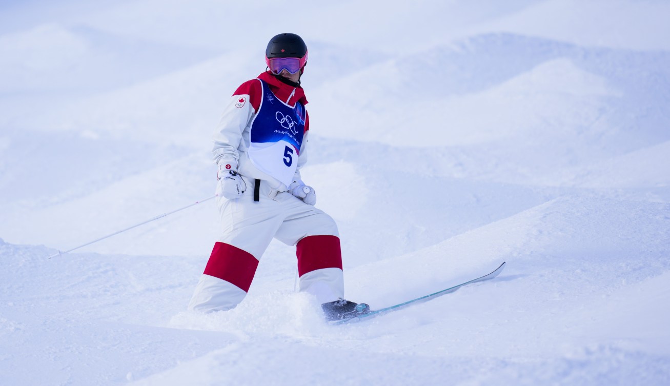 Team Canada’s Julien Viel warms up before competing in freestyle ski moguls