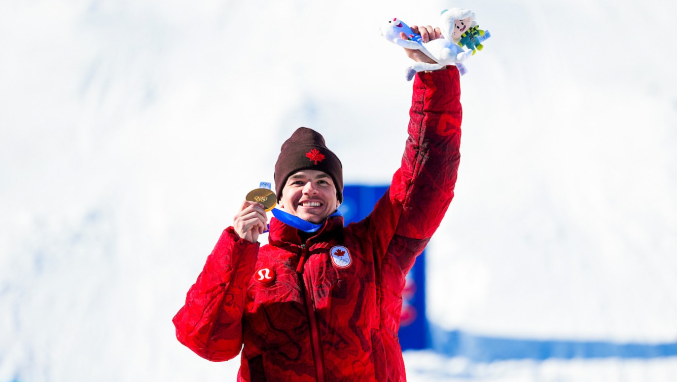 Mikael Kingsbury celebrates winning a gold medal
