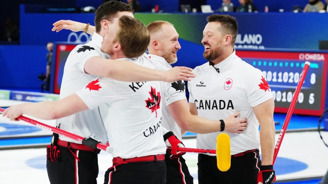 Team Canada, from left to right, Brett Gallant, Marc Kennedy, Brad Jacobs, and Ben Hebert celebrate